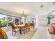 Dining room with large window providing plenty of natural light at 838 Carnoustie Dr, Venice, FL 34293