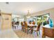 Bright dining room features large windows and mirrored wall at 838 Carnoustie Dr, Venice, FL 34293