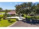 Beautiful single-story home with manicured landscaping and well-maintained lawn at 838 Carnoustie Dr, Venice, FL 34293