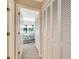 Hallway with view of bedroom and large closet storage at 838 Carnoustie Dr, Venice, FL 34293