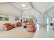 Bright living room with a large window and comfortable seating area at 838 Carnoustie Dr, Venice, FL 34293