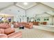 Spacious living room with high ceilings and a mirrored accent wall at 838 Carnoustie Dr, Venice, FL 34293