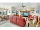 Inviting living room with built-in bookshelves and a large TV at 838 Carnoustie Dr, Venice, FL 34293
