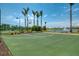 Basketball court in a beautiful landscaped setting, providing a fun and active recreational space at 8409 Placida Rd # 206, Placida, FL 33946