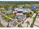 Overhead view of the clubhouse featuring a community pool, palm trees, and recreational facilities at 8409 Placida Rd # 206, Placida, FL 33946