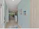 Inviting condo foyer showcasing coastal-themed decor and an open entryway leading to a comfortably furnished living space at 8409 Placida Rd # 206, Placida, FL 33946