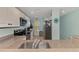 Modern kitchen boasts stainless steel appliances, granite countertops, and ample natural light at 8409 Placida Rd # 206, Placida, FL 33946