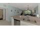 Open concept: Kitchen flows into living room area with view to outside at 8409 Placida Rd # 206, Placida, FL 33946