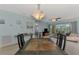 Inviting living room with balcony access and seamless flow to dining area and bedroom at 8409 Placida Rd # 206, Placida, FL 33946