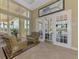 A welcoming lobby area with comfortable seating, large windows, and views of the pool at 8409 Placida Rd # 206, Placida, FL 33946