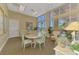 Bright meeting room with large windows, comfortable seating, and tranquil views of nature at 8409 Placida Rd # 206, Placida, FL 33946