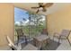 Screened patio with seating, providing wooded views at 8409 Placida Rd # 206, Placida, FL 33946