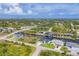 An aerial view overlooking waterfront homes with canals, bridges and beautiful landscapes at 8634 Santa Cruz Dr, Port Charlotte, FL 33981