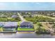 An aerial view shows a waterfront home with a screened pool and backyard at 8634 Santa Cruz Dr, Port Charlotte, FL 33981
