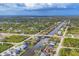 An aerial view showing houses along a canal in a beautiful residential neighborhood at 8634 Santa Cruz Dr, Port Charlotte, FL 33981