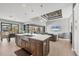 Open-concept kitchen with island seating, stainless steel appliances, and easy access to outdoor living at 8634 Santa Cruz Dr, Port Charlotte, FL 33981