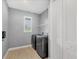 A modern laundry room featuring a new washer and dryer for convenient chores at 8634 Santa Cruz Dr, Port Charlotte, FL 33981