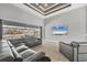 Spacious living room with large sectional sofa, TV, and sliding glass doors overlooking the water at 8634 Santa Cruz Dr, Port Charlotte, FL 33981