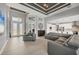 Open-concept living room boasts high ceilings, natural light, neutral colors, and seamless flow to kitchen at 8634 Santa Cruz Dr, Port Charlotte, FL 33981