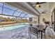 Outdoor patio boasting a screened enclosure, in ground pool and waterfront views at 8634 Santa Cruz Dr, Port Charlotte, FL 33981