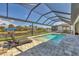 This screened-in pool features plenty of space for chairs and an exquisite view of the water at 8634 Santa Cruz Dr, Port Charlotte, FL 33981