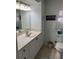 Neat bathroom featuring ample cabinet space, decorative touches, and a functional layout at 868 Baveno Dr, Venice, FL 34285