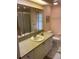 Bright bathroom with a large mirror, vanity with sink, and toilet at 868 Baveno Dr, Venice, FL 34285