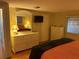 A serene bedroom with dressers, a TV, and a comfortable bed, perfect for relaxation at 868 Baveno Dr, Venice, FL 34285