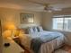 Relaxing bedroom with a comfortable bed, soft lighting, and a peaceful ambiance for restful nights at 868 Baveno Dr, Venice, FL 34285
