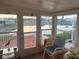 Charming sunroom with views of the lake and community, perfect for relaxation and enjoying the serene surroundings at 868 Baveno Dr, Venice, FL 34285