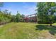 Sprawling backyard with a screened-in lanai and pool offers plenty of room for outdoor activities at 9118 Coachman Dr, Venice, FL 34293