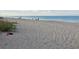 Expansive beach view with crystal-clear water and a sandy shoreline, perfect for relaxation and recreation at 9118 Coachman Dr, Venice, FL 34293