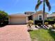 Charming single-Gathering home with a two-car garage and well-manicured landscaping at 9118 Coachman Dr, Venice, FL 34293