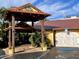 Inviting entrance to Farlow's restaurant, featuring lush greenery and a covered walkway, ample parking at 9118 Coachman Dr, Venice, FL 34293