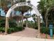 Entrance to Venice Fishing Pier with lush landscaping and covered area at 9118 Coachman Dr, Venice, FL 34293