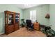 Bright home office with built-in wooden shelving and a dark executive chair at 9118 Coachman Dr, Venice, FL 34293