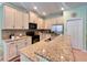 Kitchen featuring stainless steel appliances, granite counters, and ample cabinet space at 9118 Coachman Dr, Venice, FL 34293