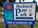 Brohard Paw Park sign, featuring a welcome message with a dog illustration at 9118 Coachman Dr, Venice, FL 34293