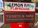 Bright and colorful Lemon Bay Playhouse sign, advertising tickets and information for upcoming shows at 9118 Coachman Dr, Venice, FL 34293