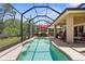 Screened-in pool and lanai offers a serene outdoor experience at 9118 Coachman Dr, Venice, FL 34293