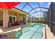 Sparkling blue pool with built-in steps provides a refreshing escape at 9118 Coachman Dr, Venice, FL 34293