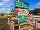 Sarasota County Pioneer Plaza and Dignam Gathering Stage sign promoting a farmers market every Thursday at 9118 Coachman Dr, Venice, FL 34293