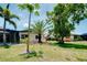 The well-manicured backyard featuring a view of the pool at 915 S Doral Ln, Venice, FL 34293