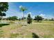 Scenic view of the backyard leading to the lake and golf course at 915 S Doral Ln, Venice, FL 34293