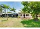 The well-manicured backyard featuring a view of the pool at 915 S Doral Ln, Venice, FL 34293