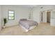 Spacious bedroom with neutral tones, a ceiling fan, and carpet flooring at 915 S Doral Ln, Venice, FL 34293