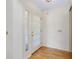 Bright entryway featuring beautiful hardwood floors and a clear glass door at 915 S Doral Ln, Venice, FL 34293
