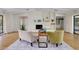Inviting living room with fireplace, built-ins, and seating area featuring an accent rug at 915 S Doral Ln, Venice, FL 34293
