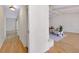 Bright living room with hardwood floors, modern lighting, and a neutral color palette at 915 S Doral Ln, Venice, FL 34293
