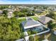 An aerial perspective of a property complete with a screened-in pool, shed, and a fenced backyard at 9277 Saint Catherine Ave, Englewood, FL 34224